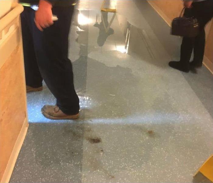 standing water on floor of hallway
