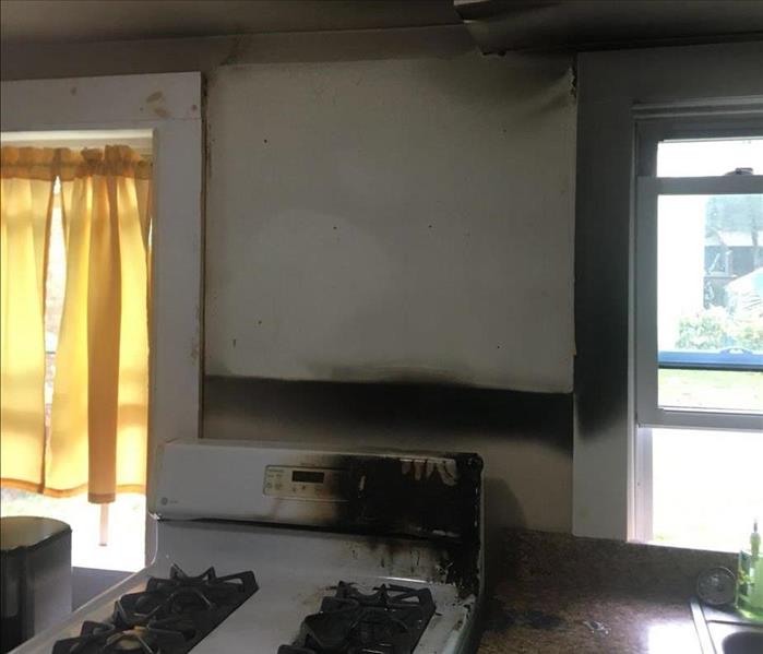 soot damage on walls after small kitchen fire